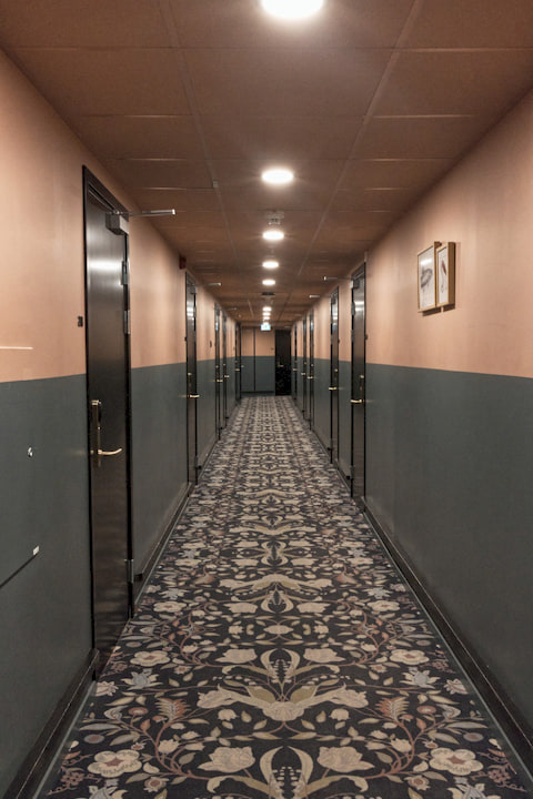 a hotel corridor in earthy colors